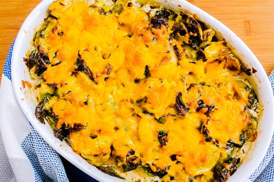 brussel sprouts au gratin with melted cheese in a baking dish