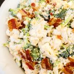 white bowl with Broccoli Cauliflower low carb salad with crispy bacon