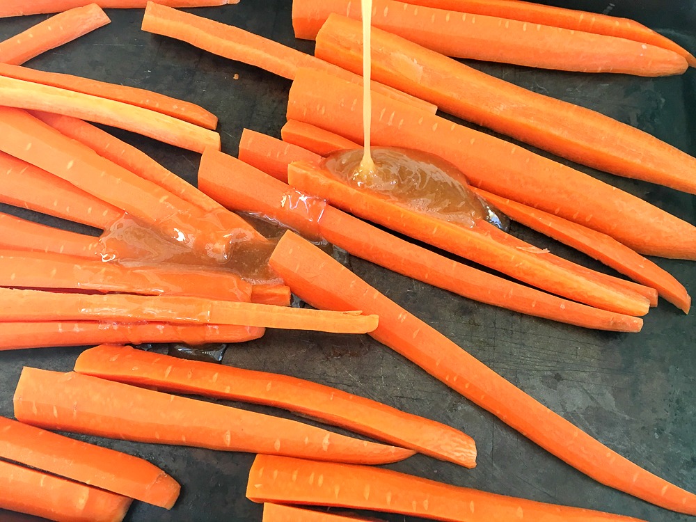 sliced carrots with a brown sugar honey glaze to be roasted