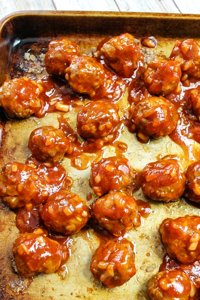 cookie sheet with glazed BBQ homemade meatballs