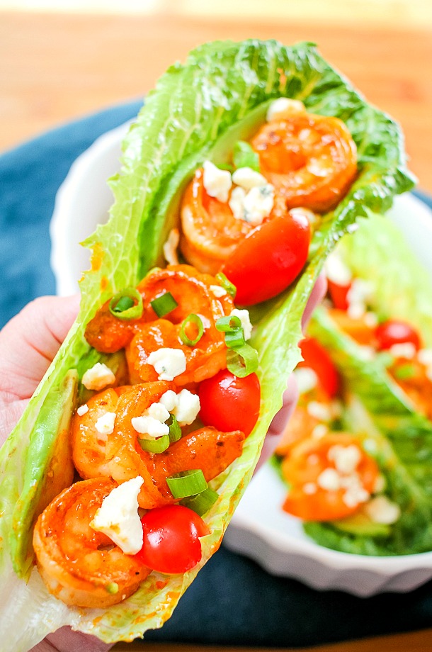buffalo shrimp with tomatoes and blue cheese in lettuce wrap