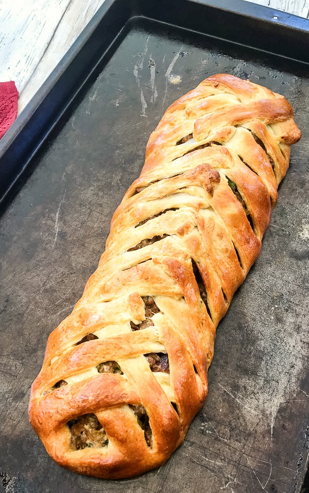 cookie sheet with crescent roll braid with sausage filling