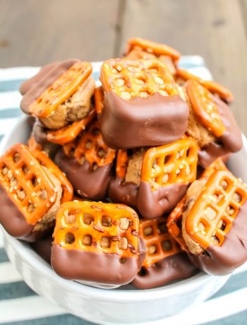bowl of waffle pretzels filled with peanut butter and dipped in chocolate
