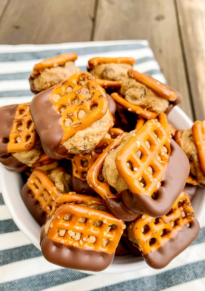 a pile of peanut butter filled pretzel bites dipped in chocolate