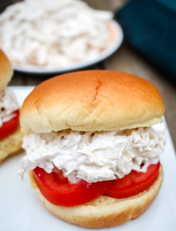 a chicken salad sandwich with tomatoes