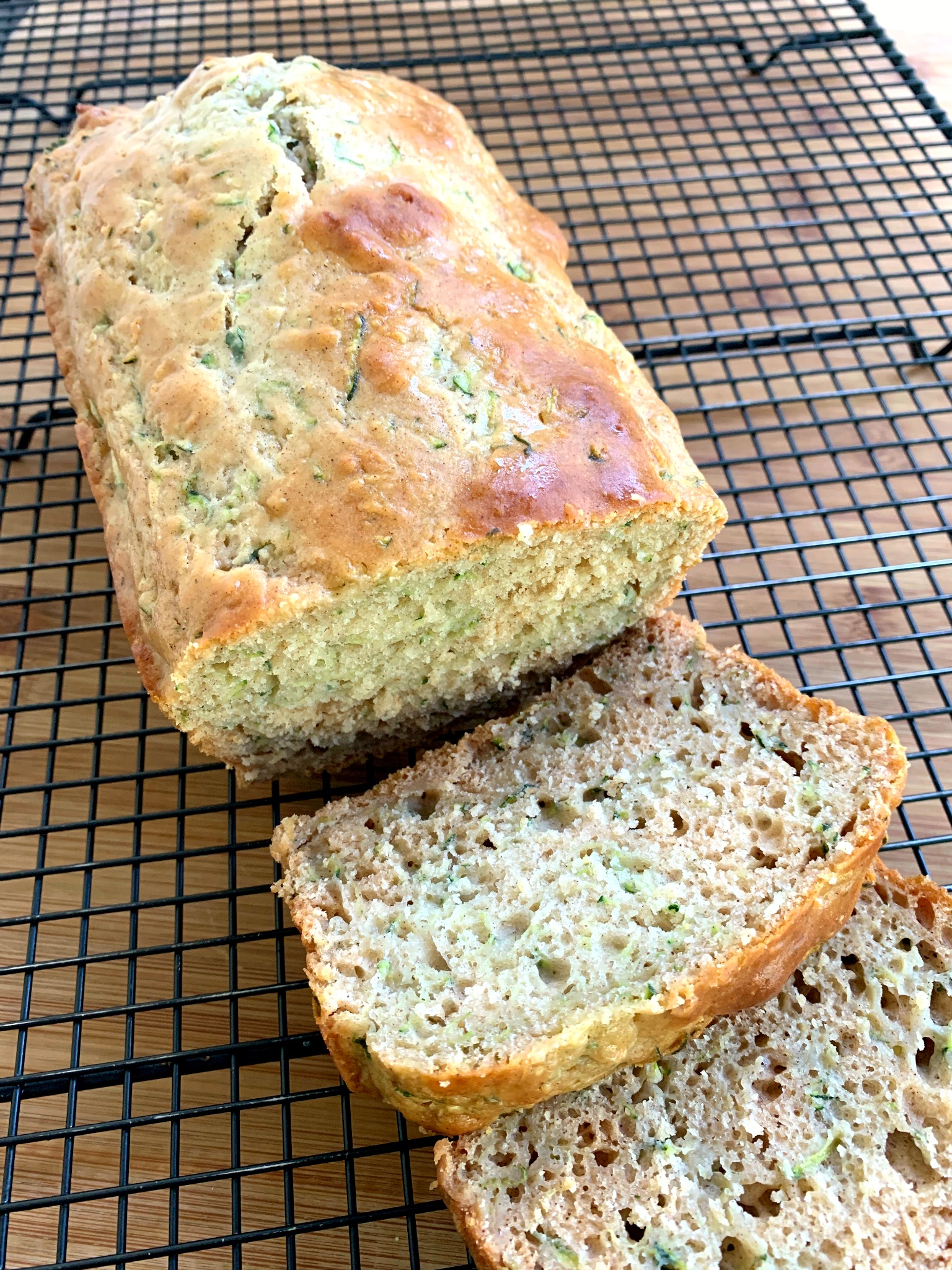 a loaf of healthy zucchini bread with slices cut off
