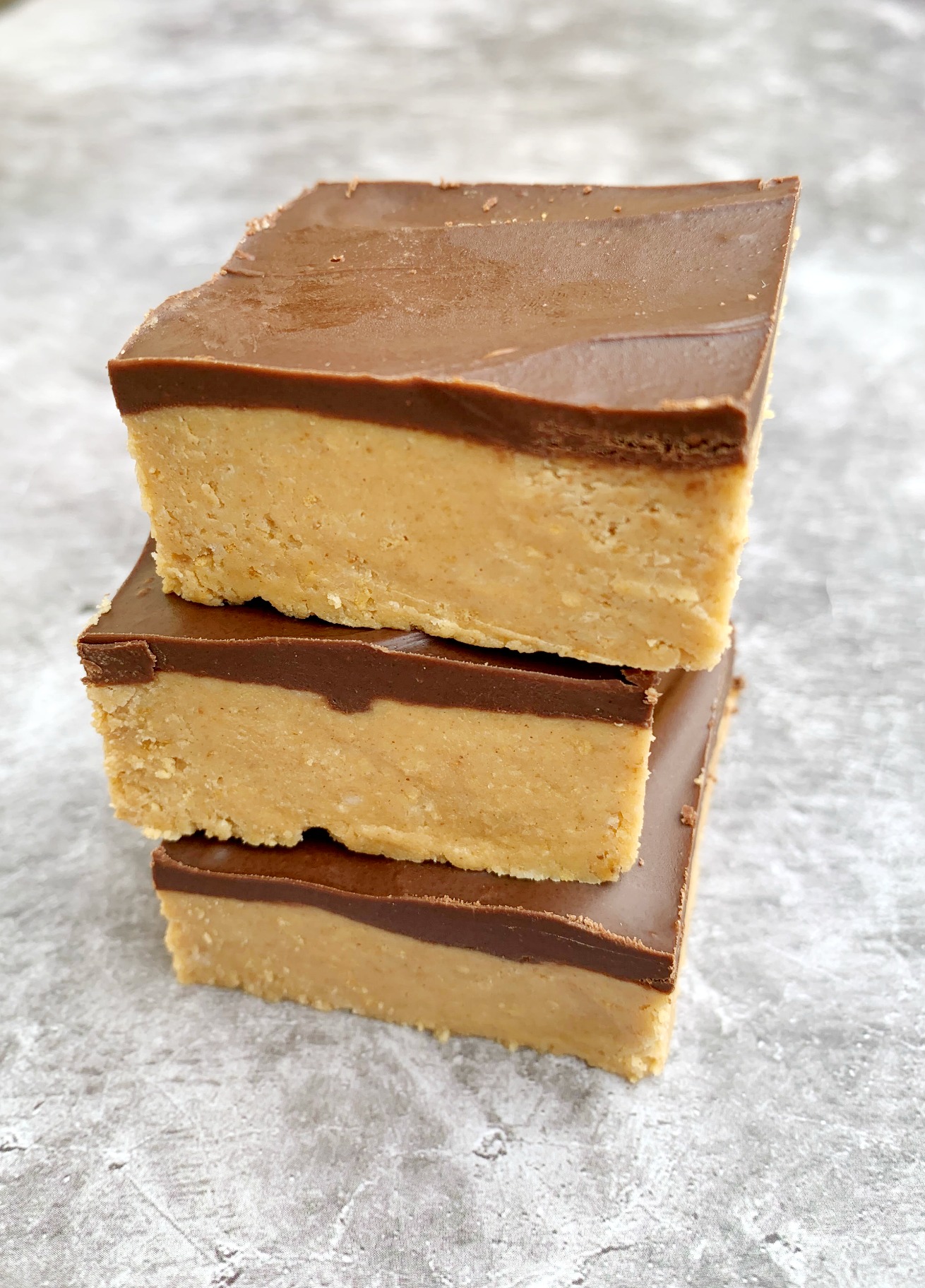 3 peanut butter chocolate bars stacked on top of each other