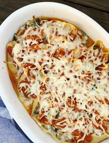white oval dish with stuffed shells after baking