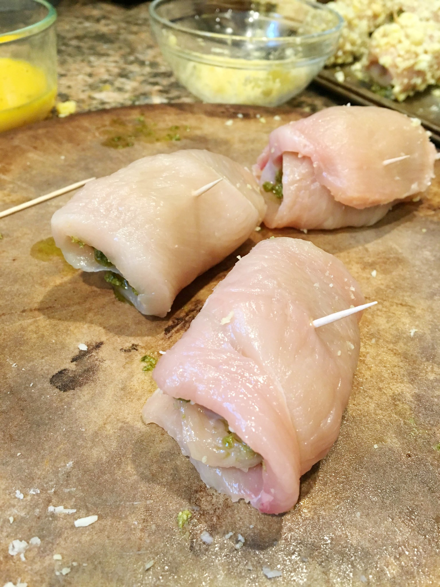 chicken roll-ups before cooking secured with a toothpick