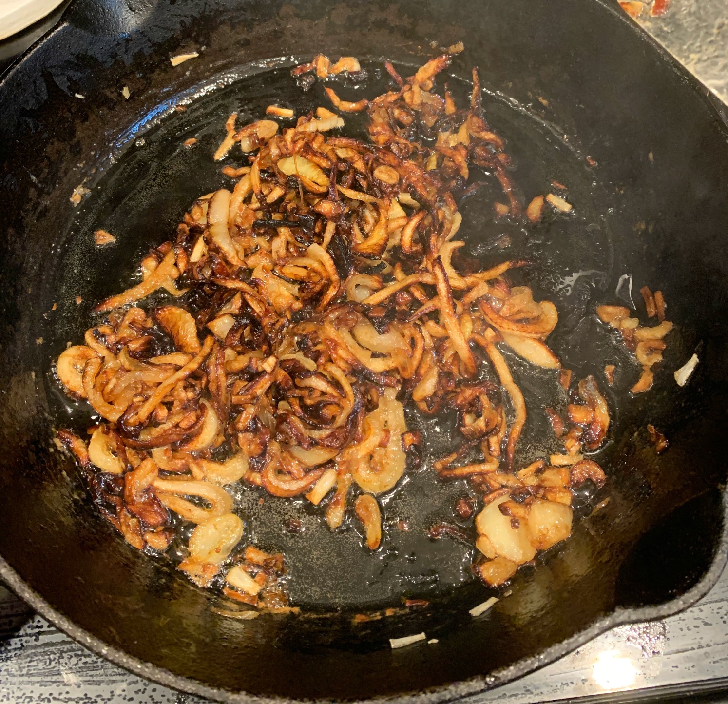 fried onions in a cast iron skillet