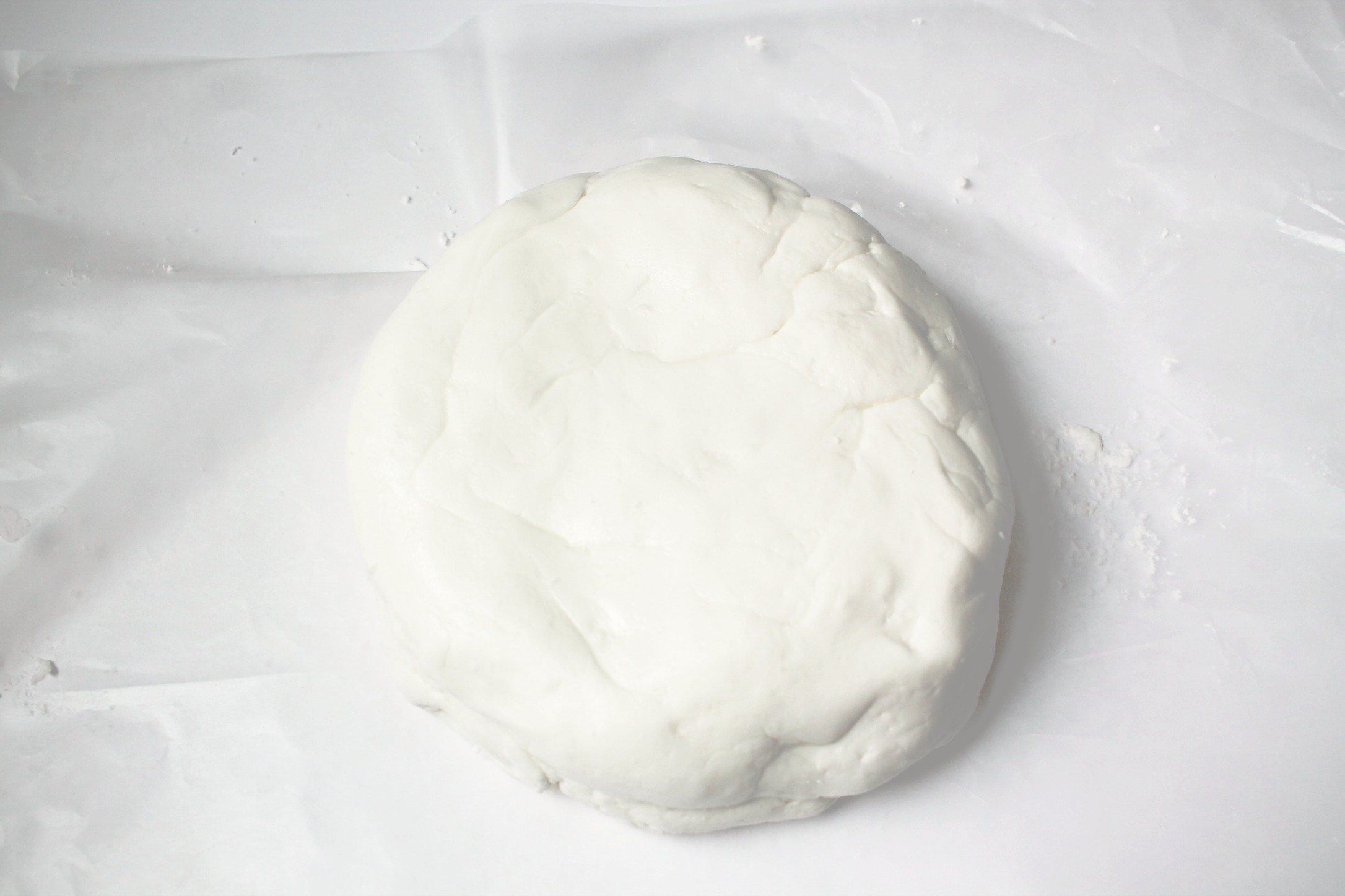 white marshmallow fondant in a disc