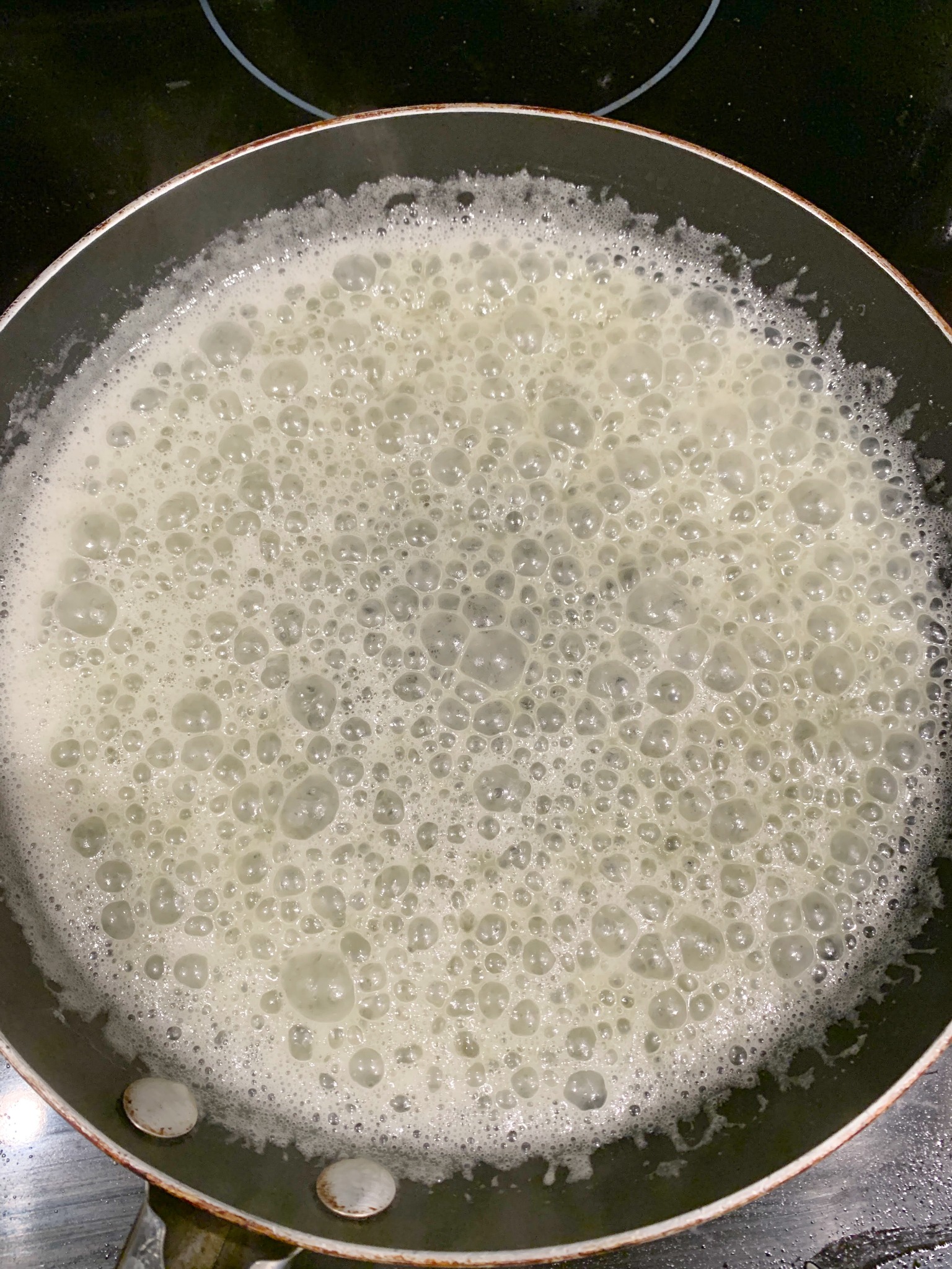 skillet with bubbly butter and sugar