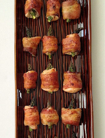 Bacon-Wrapped Chili Chicken Bites with Asparagus Appetizer Recipe is a delicious, easy-to-prepare meal that's perfect for entertaining guests. The combination of sweet chili sauce and spicy chicken will have everyone asking for more. You'll love this quick and easy appetizer served with a side salad for a healthy dinner option.