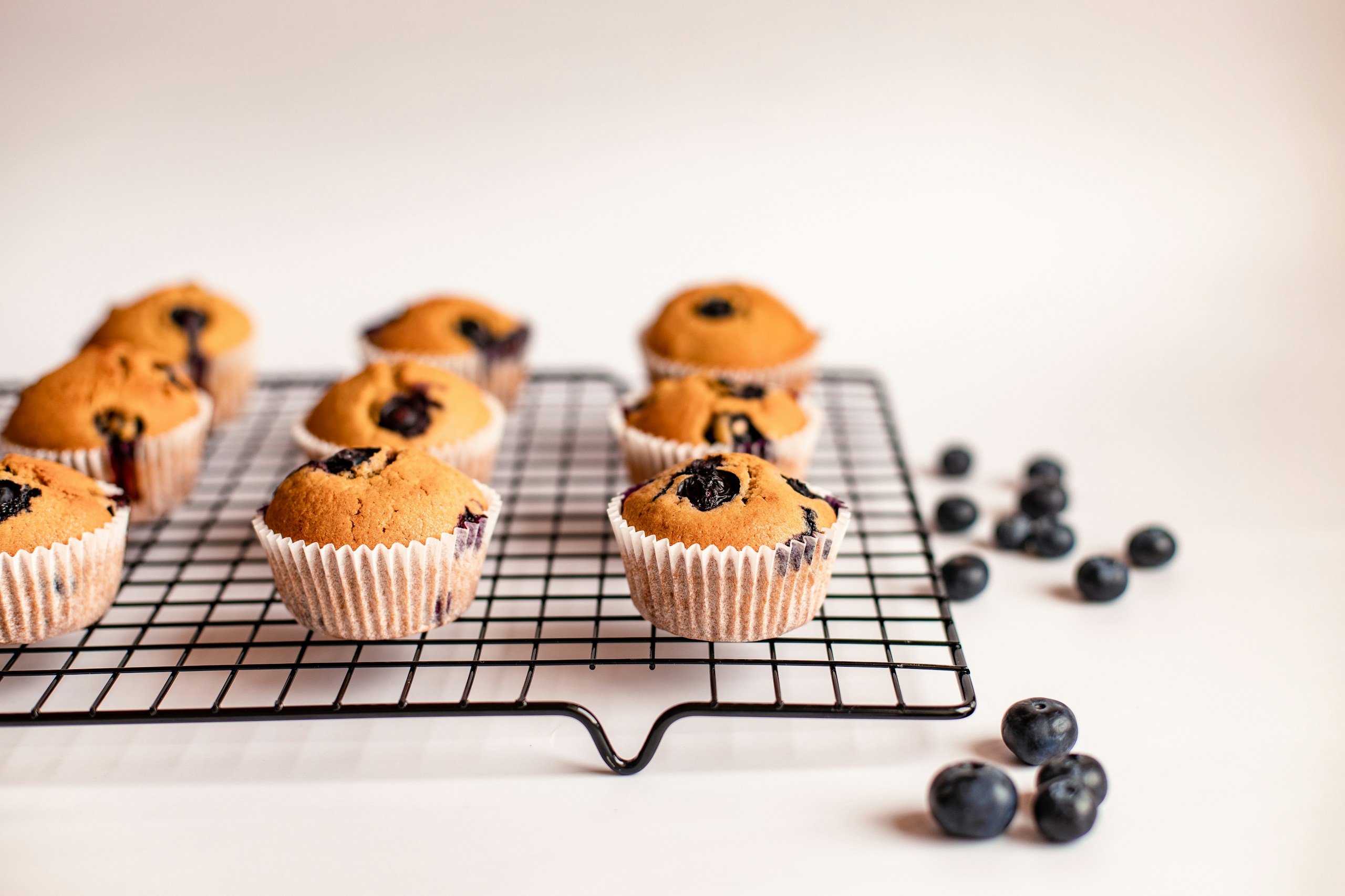 blueberry muffins cooling on a cooling rack